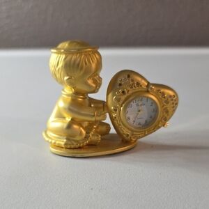Vintage Elgin Miniature Quartz Clock Featuring a Gold Plated Angel Or Cherub.